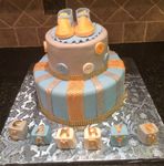 Baby shower cake blue and gold with the booties