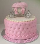 Baby shower cake with baby carriage on top